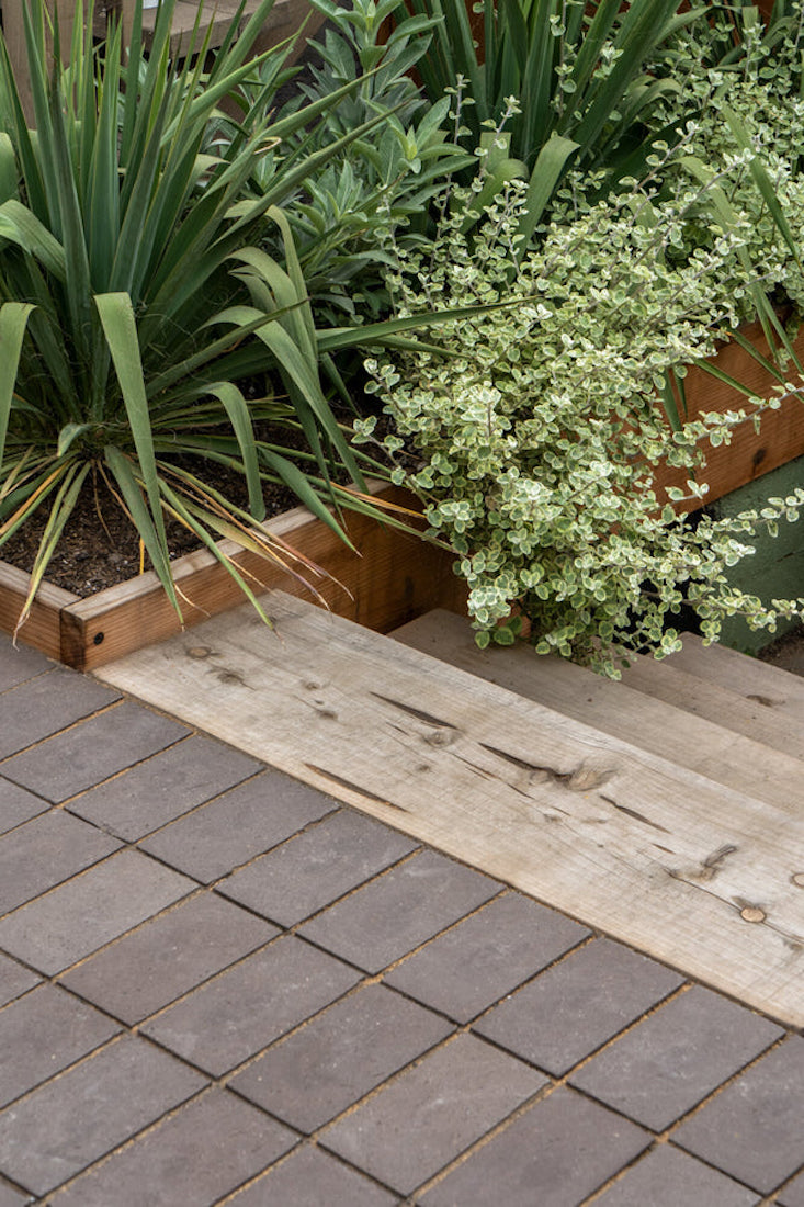 Molly loves âthe transition of chunk cypress to clay pavers&#8221; in this Outer Sunset garden. I love the two textures touching and their harmony.â The clay pavers are by ORCA and made in Sacramento. âWe love using them as a sandset surface option with swept decomposed granite in-between for a very relaxed permeable surface.â