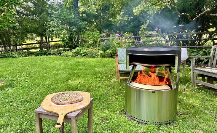 The Pi Fire pizza oven attachment sitting pretty atop my Solo Stove.