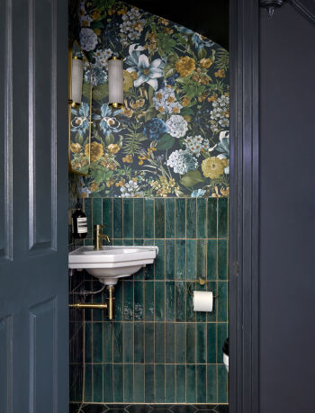 Dark Understairs WC with floral wallpaper