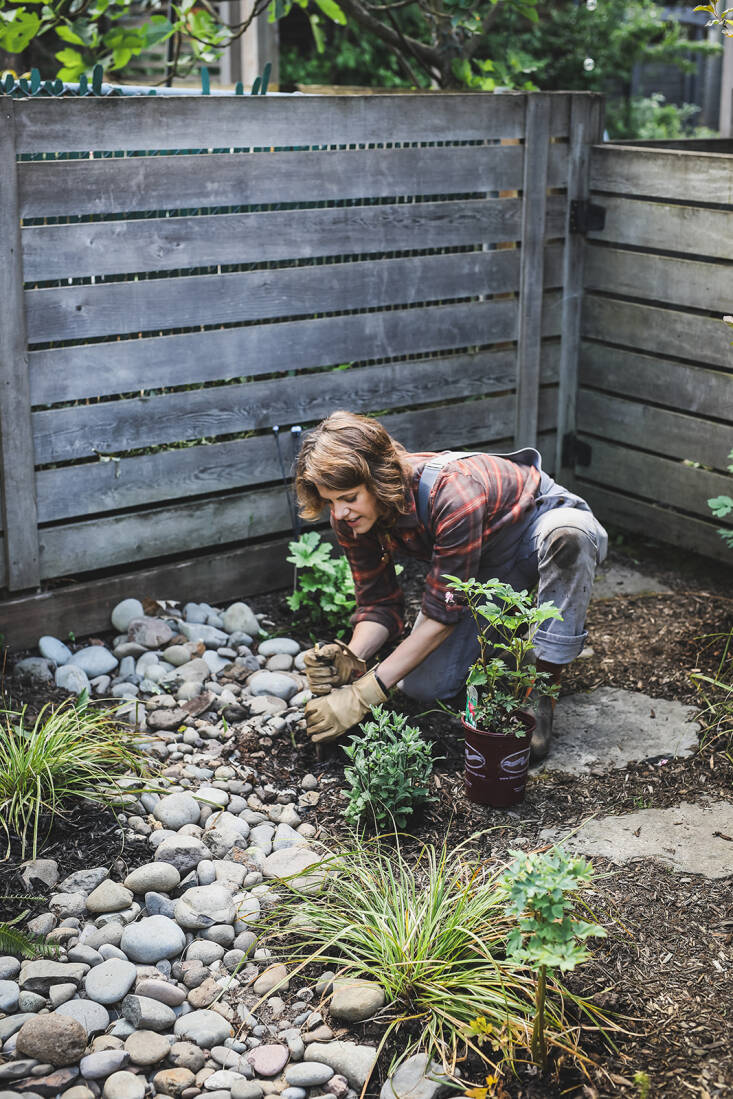   &#8220;The big takeaway is that gardens are not static and how important it is to create zones that can morph and change over time to keep yards compelling and interesting,&#8221; says Kate. Here, she&#8217;s adding plants to the dry river bed, now that Sara&#8217;s kids no longer play there.