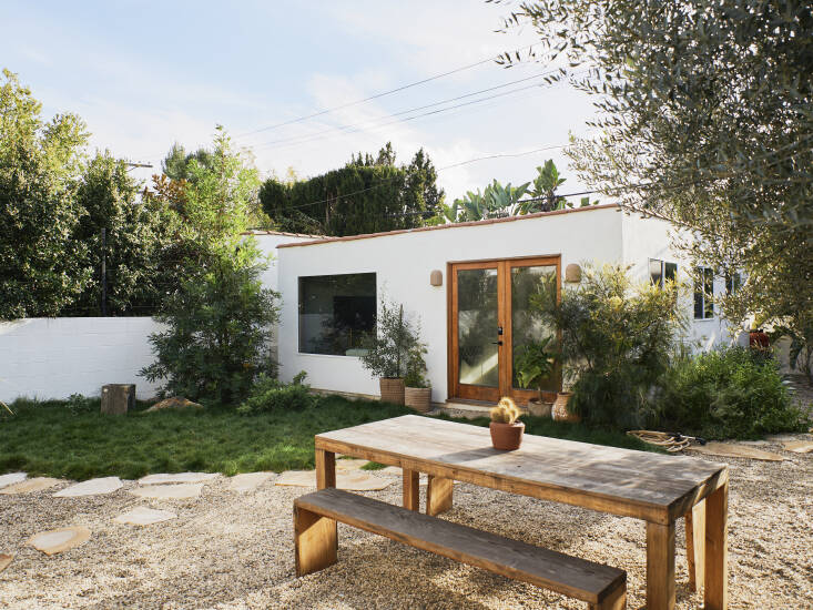 The building seen here is former two-car garage converted into a small studio the couple now rents for production through Peerspace. The etched terracotta pots at the entrance are from Plant Provisions. Photograph by Marc Gabor for Finca Glenfeliz.