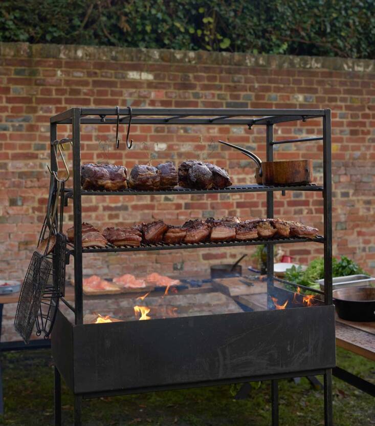 The company is based in Somerset, UK, and specializes in bespoke fire kitchens (chefs Gordon Ramsey and Jamie Oliver are fans) but recently added Portico Grills (made in Somerset from blackened steel) to their consumer product line. The grills come in three sizes; pictured is the medium size (£\1,760).