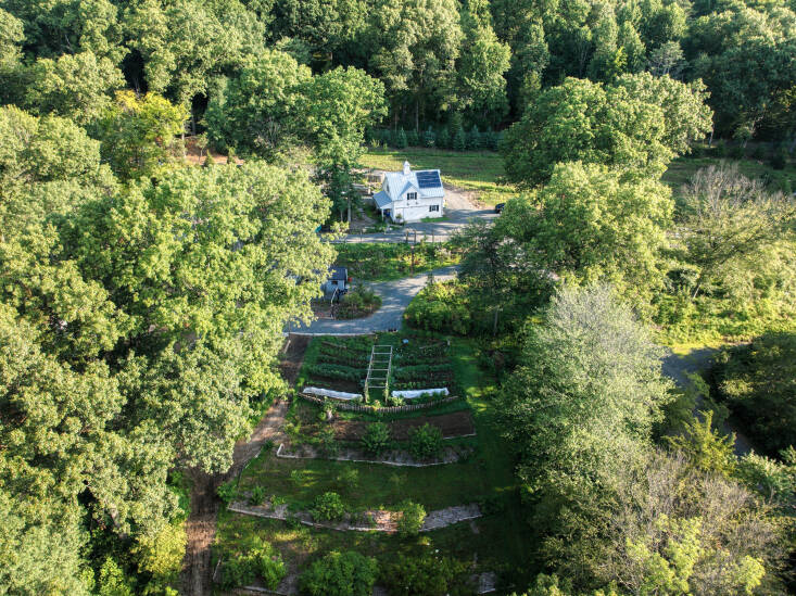 “I love multi-purpose,” says Logan. “I&#8\2\17;m always asking, how do we grow plants that look beautiful and are also edible or serve a purpose like holding the earth and slowing down water.” This overhead view of Maranatha Farm shows the utility barn and Giving Garden North, as well as permaculture terraces and orchard. Photograph by North Jersey Drone Shots.