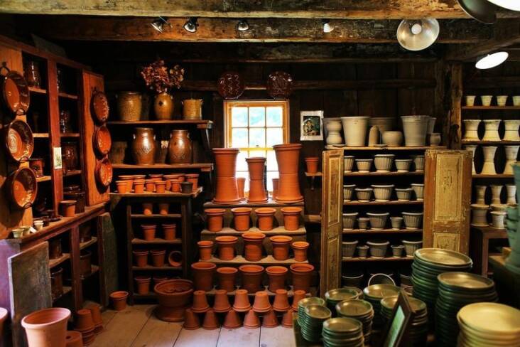 The front room holds a mix of both Guy Wolff’s pots (left) and his son Ben’s (right and foreground). 