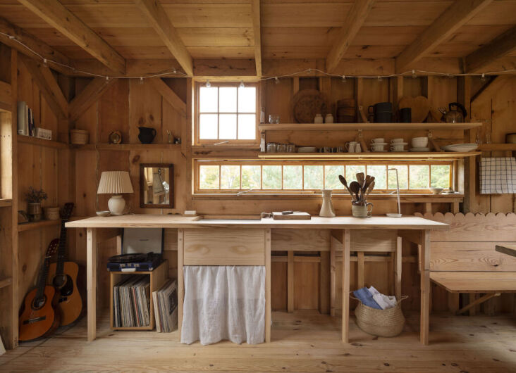 An architect couple&#8\2\17;s DIY cabin, built using a post-and-beam kit, with a wood kitchenette to match. Photograph by Matthew Williams for Remodelista: The Low-Impact Home, from Rest Your Eye Here: 9 Spaces Enveloped in Wood.