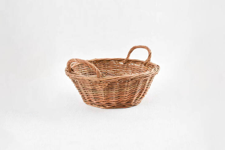 The Small French Wicker Basket is a vintage find for \$\178 at Chez Pluie Provence.