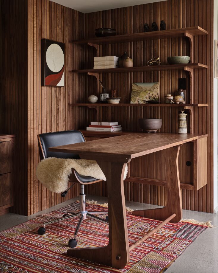 A newly remodeled study inspired by its midcentury roots. Photograph by Michael P.H. Clifford, courtesy of A\1000XBetter, from Heart, Soul, and Wood Paneling: A Work Space and Bathroom Makeover in LA, Laundry Area Included.