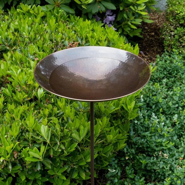 The Burnt Copper Birdbath is made of stainless steel (with an antique copper finish) and comes with a 34-inch stake for easy insertion.