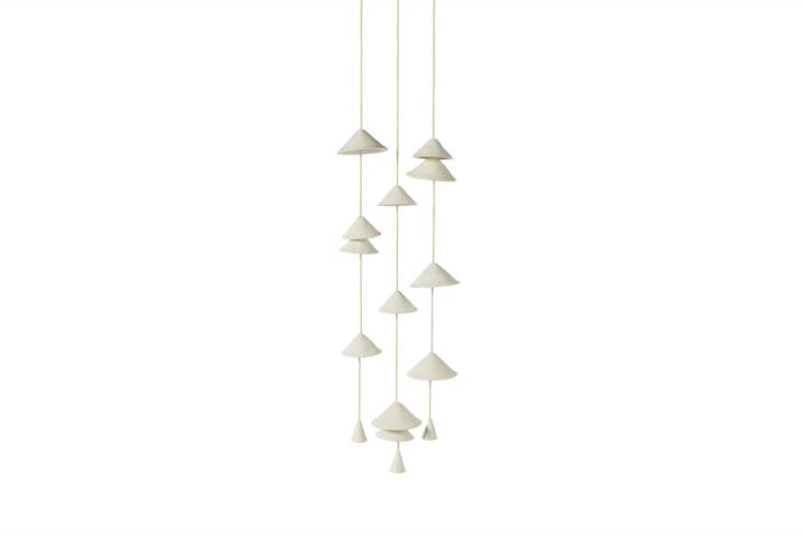 The EOS Wind Chime is made of fine stoneware with a white satin glaze and durable cotton rope designed for the outdoors; $24 for a single strand (shown in a group of three) at Stag & Manor.